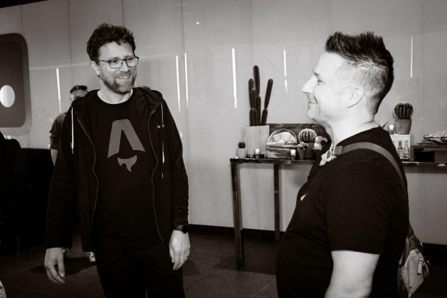 A black and white photo of Matt Kane, formerly of Netlify and now an Astro core member, smiling with Nick Taylor, also formerly of Netlify.