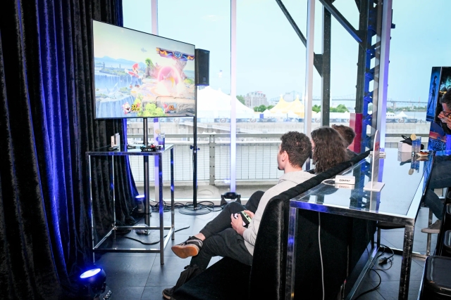 Guests play Super Smash Bros at the video game lounge.